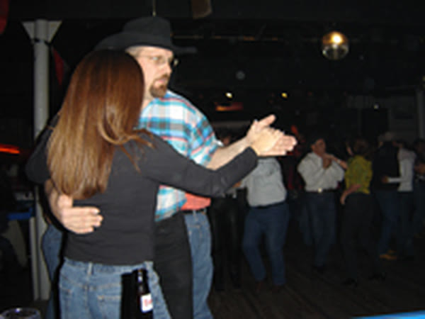 A couple being taught to dance at Rodeo Exchange in 2004