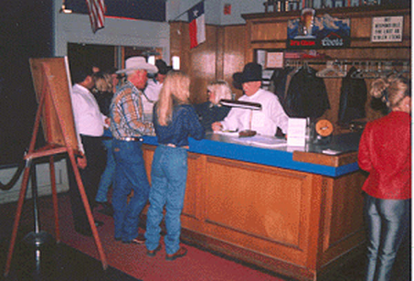 Cowboys at the ticket counter inside the front door in the late 1990s