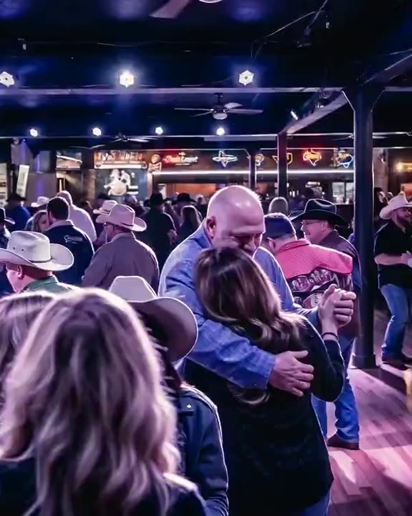 Couples two-stepping on the dance floor